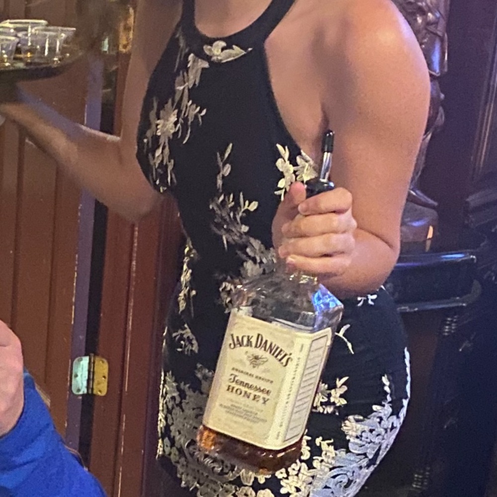 Form fitting black and gold cocktail dress